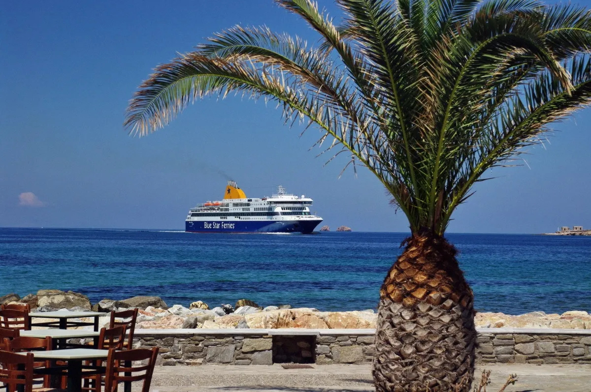 Ferry approaching the port of Paros with passengers arriving for island boat trips