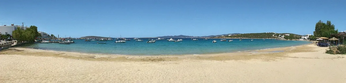 Fishing boats in the quiet harbour of Alyki village in Paros